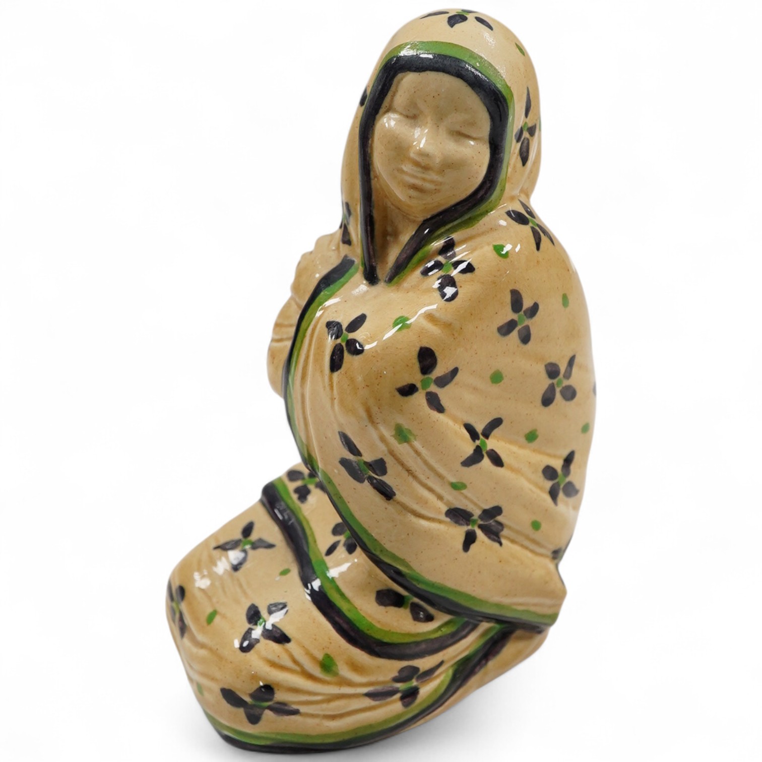An Ashtead pottery figure of a kneeling ‘eastern lady’, stamped to the base, 15cm high
